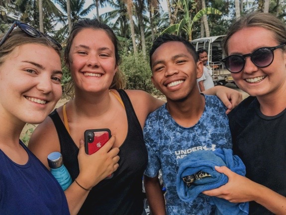 Young travellers posing together during a cultural exchange experience