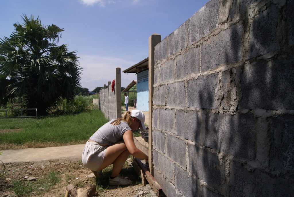 Volunteer helping with a building project in Thailand