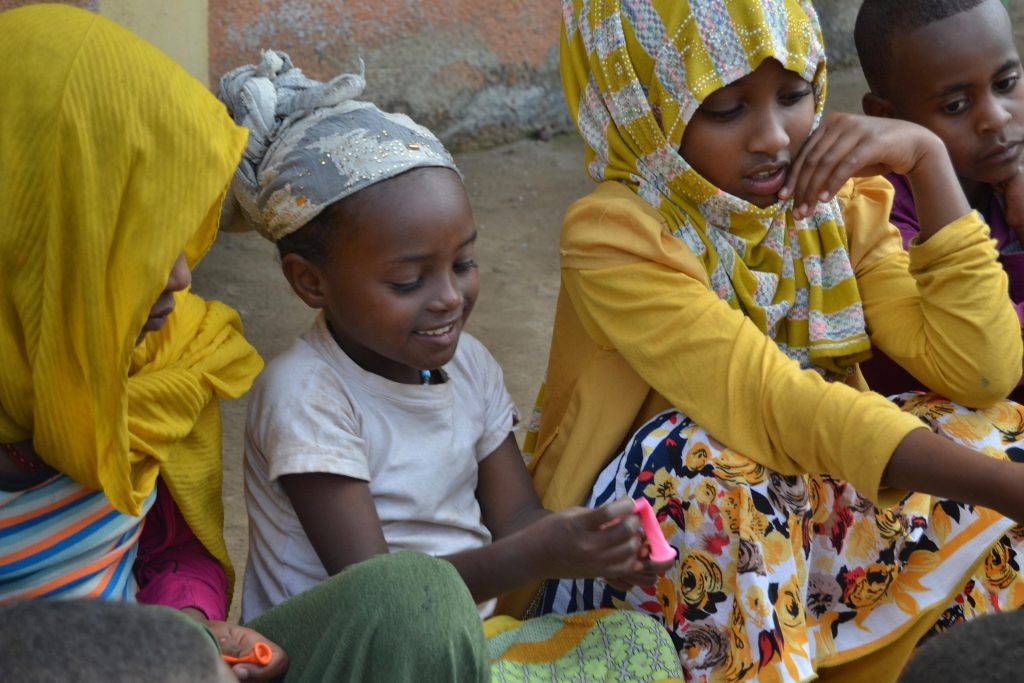 Group of children participating in an educational activity in Ethiopia