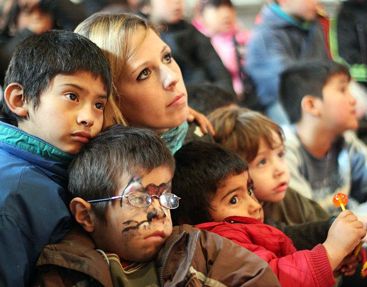 Volunteer engaging with children during a care project in Argentina