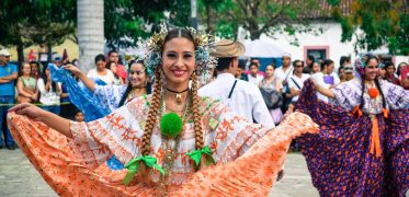 Traditional Costa Rican Tica lady dancing in the street carnival